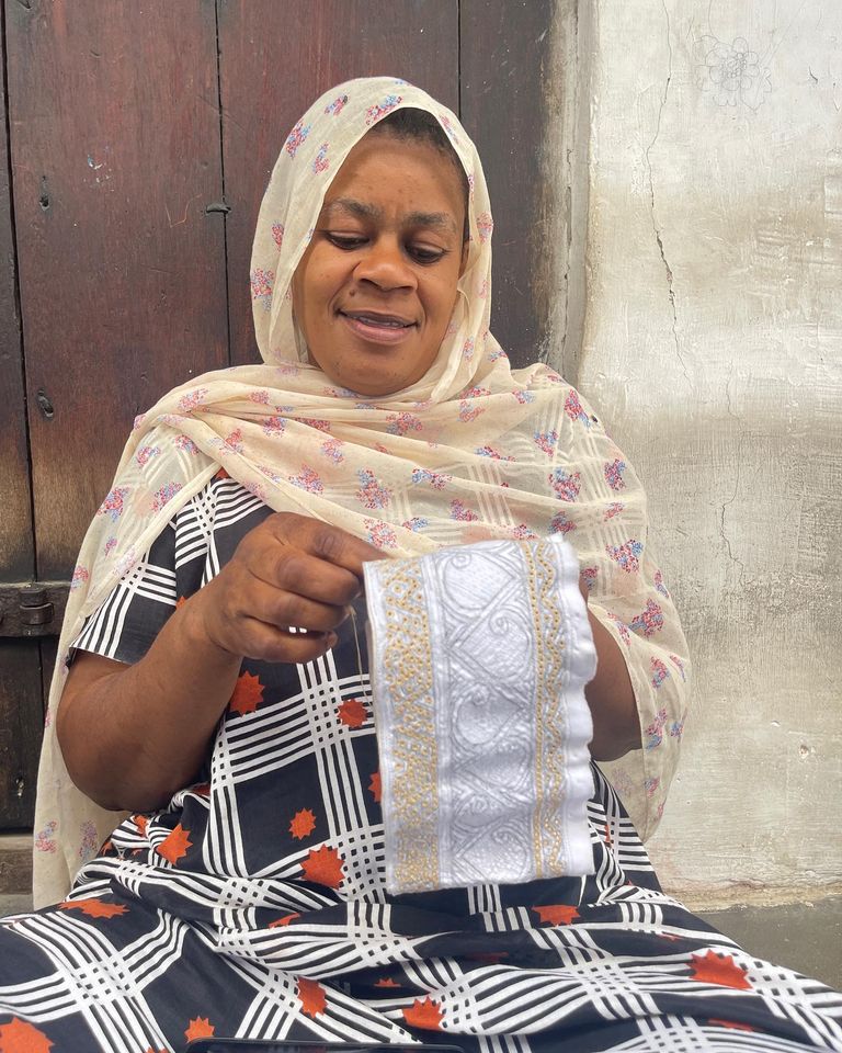 Stone Town community members sharing a moment together, reflecting the warmth and togetherness of the Zanzibari people